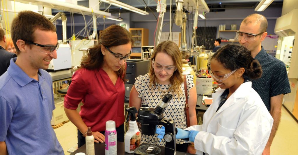 An ACS Project SEED student explains her summer research project during a site visit at Georgetown University in August 2018. (ACS Project SEED/Peter Cutts Photography)